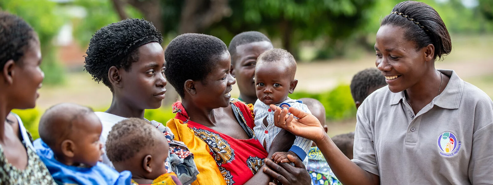 Motherstomothers Staff person greets mothers and babies