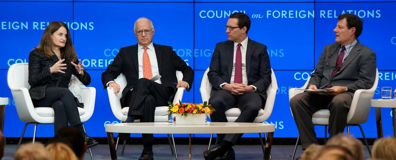 Four people on stage in front of a Council on Foreign Relations background