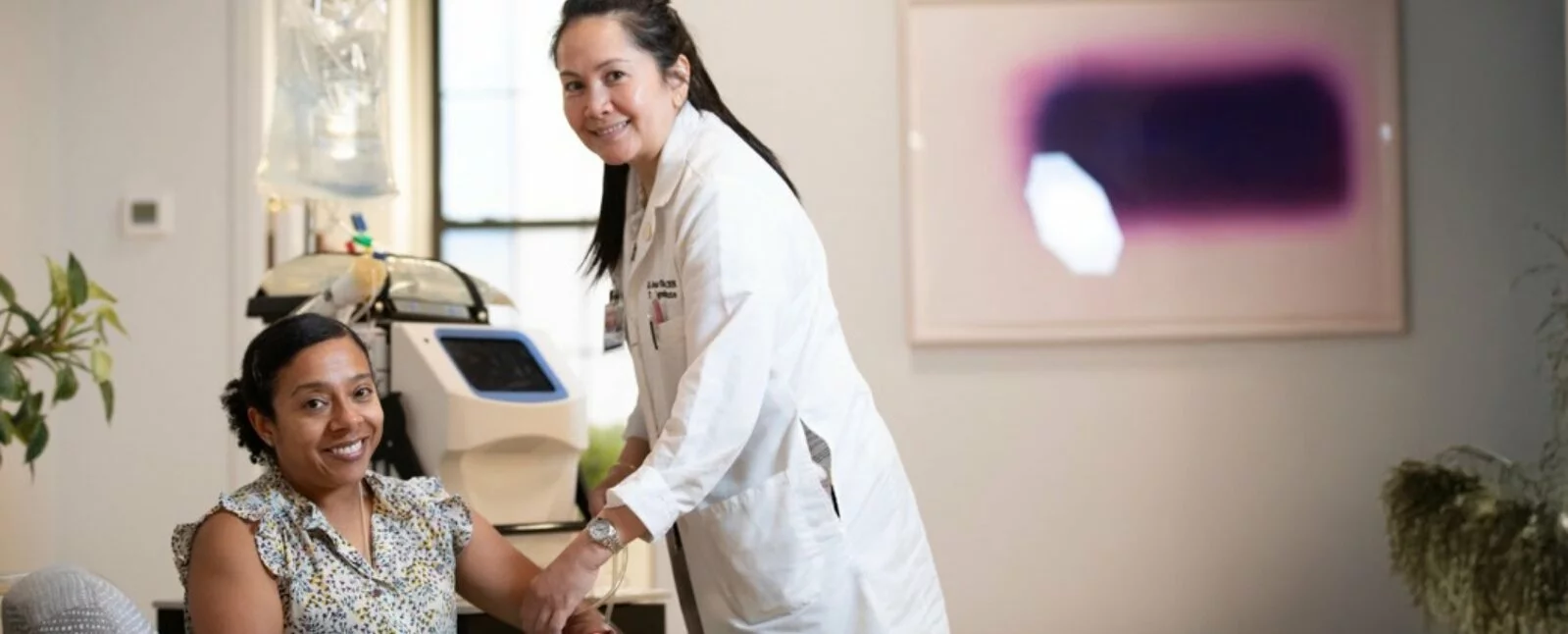 Woman and doctor in medical office.