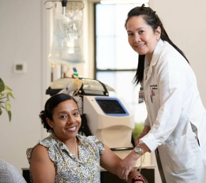 Woman and doctor in medical office.